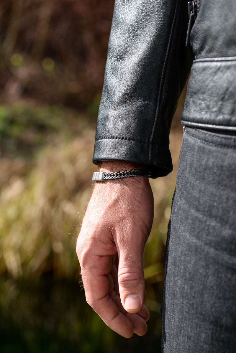 Men's personalised daddy bracelet with engraved kids names worn outdoors