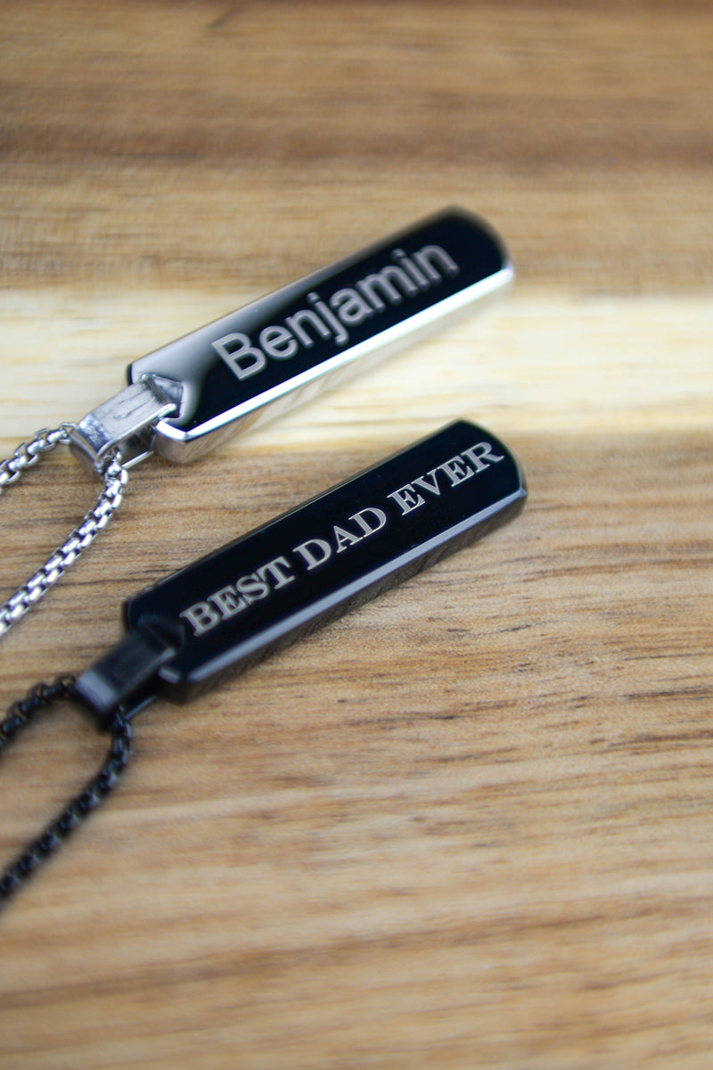 Close up engraving detail on men's personalised bar necklace stainless steel