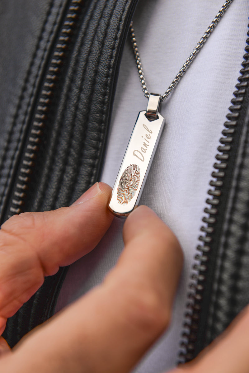 Men's personalised engraved bar necklace worn with leather jacket silver stainless steel