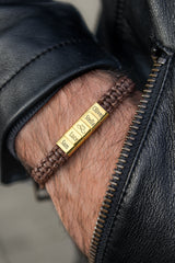Men's gold personalised engraved bar bracelet worn on wrist with leather jacket gift set