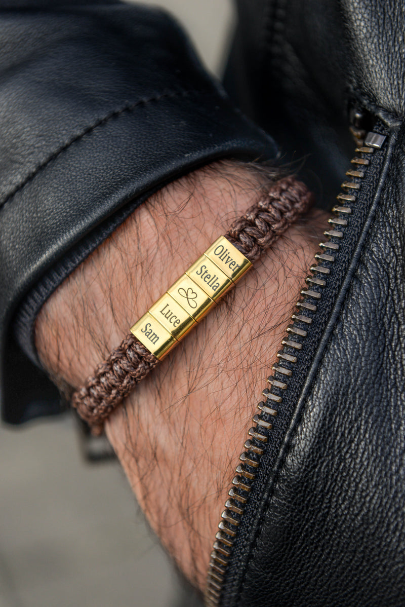 Men's gold personalised engraved bar bracelet worn on wrist with leather jacket gift set