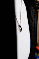 Men's black personalised bar necklace worn on model second angle