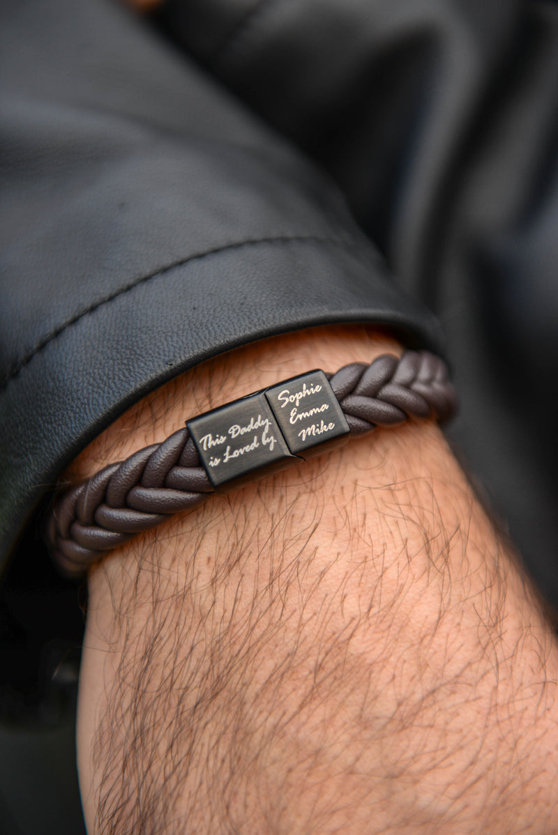 Men's personalised braided leather bracelet with engraved daddy clasp worn on wrist