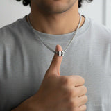 Men's silver Cuban link chain necklace held in hand stainless steel personalised